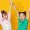 Happy children with their hands in the air