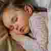 Little girl asleep in bed