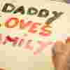 Children and father's crafting at family day prison visit.