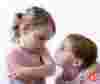 Two children experiencing sibling rivalry