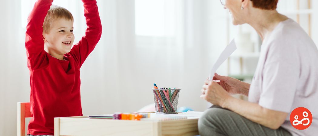 child with teacher in classroom