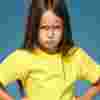 Girl in yellow t-shirt with her hands on her hips