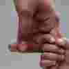 Parent's hand holding on to a child's