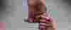 Parent's hand holding on to a child's